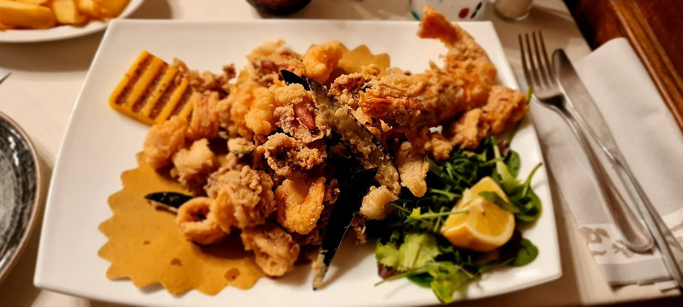 Crispy fried seafood with grilled polenta